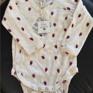 Kate Quinn Cream Onesie with Red Strawberry Print
